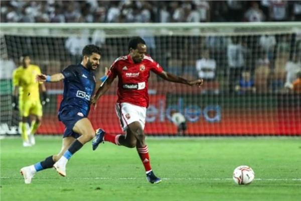 بيرسي تاو وزيزو من مباراة سابقة بين الأهلي والزمالك